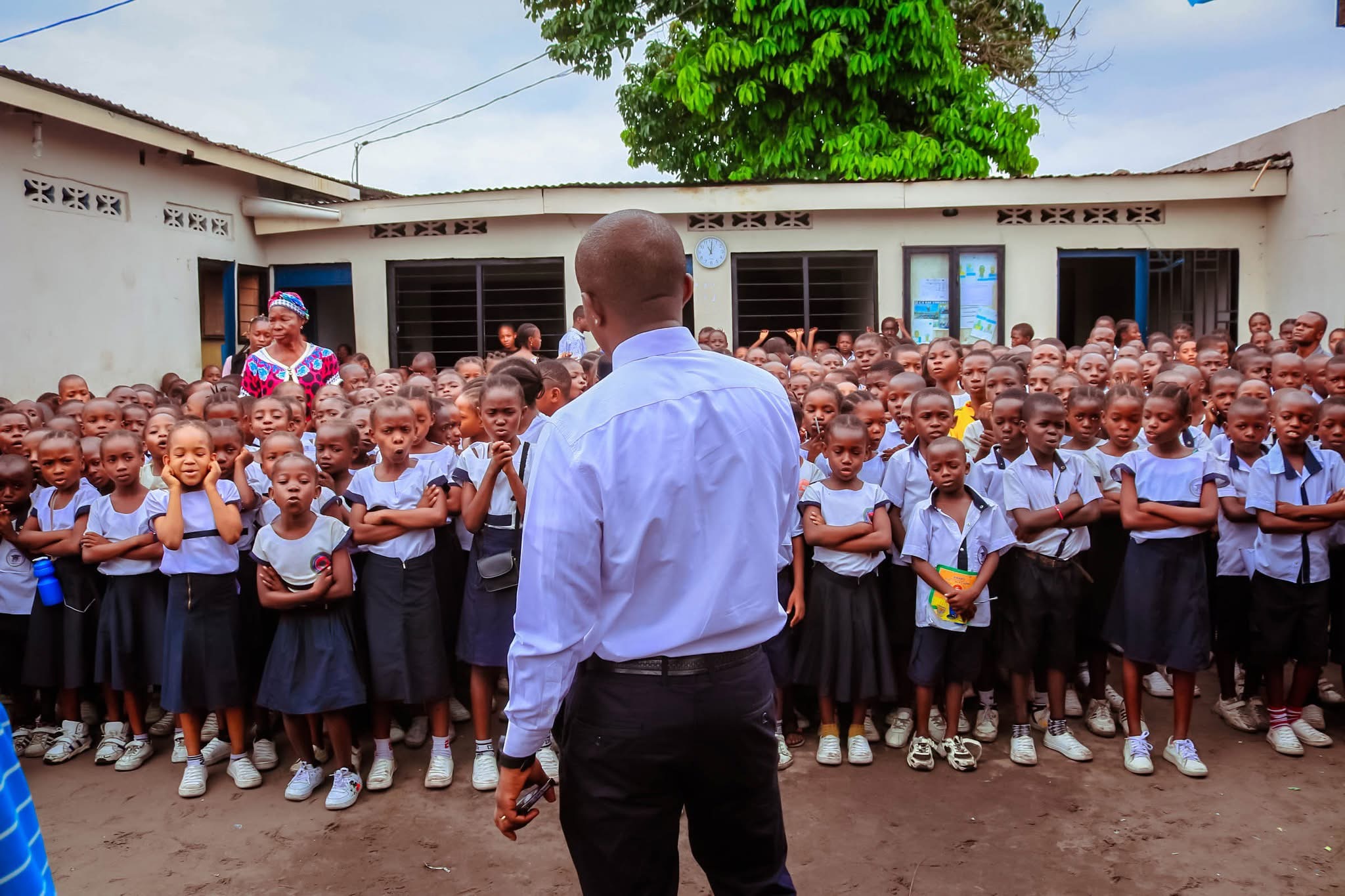 A BCP teacher working closely with students in Kinshasa