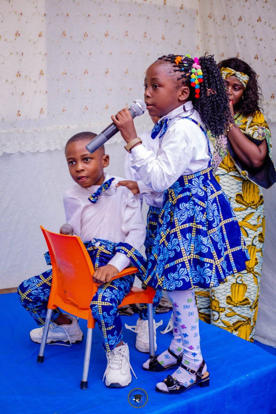 Young students performing on a stage