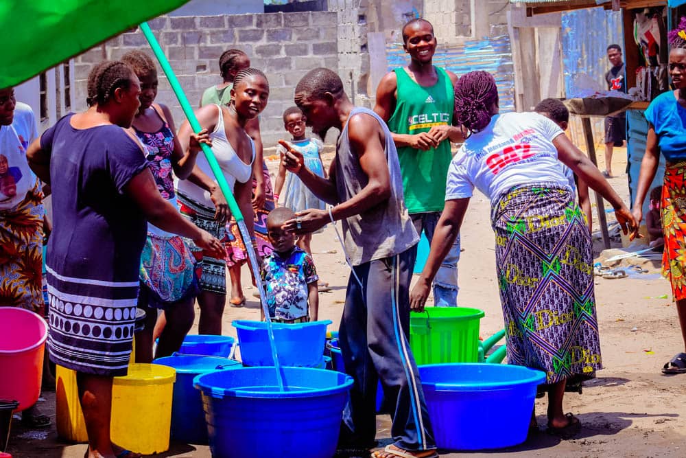 Villagers collecting clean water from a new BCP well